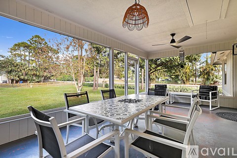 A patio with a table and chairs is available for rent.