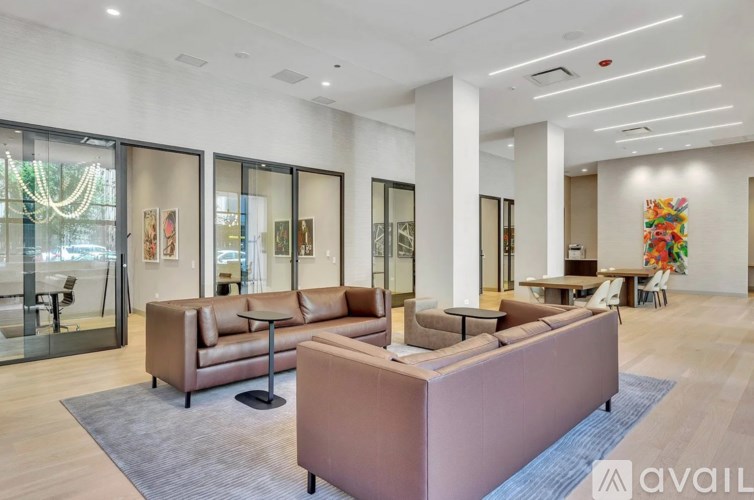 A spacious living room with a large couch and a coffee table.