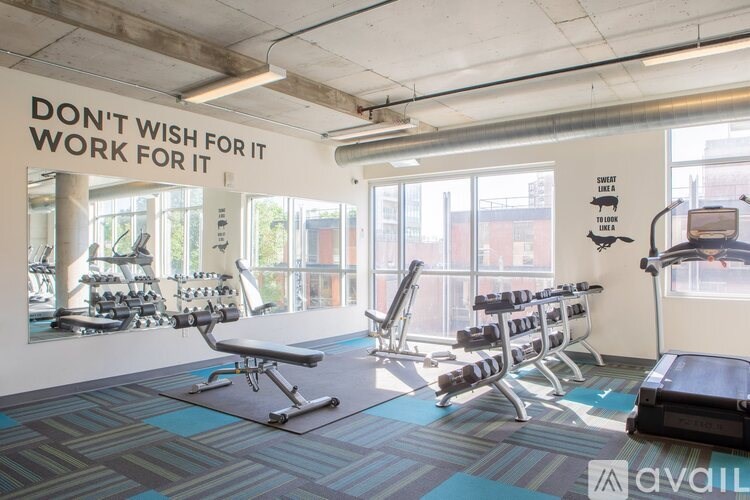 A gym with a sign that says "Don't wish for it, work for it".