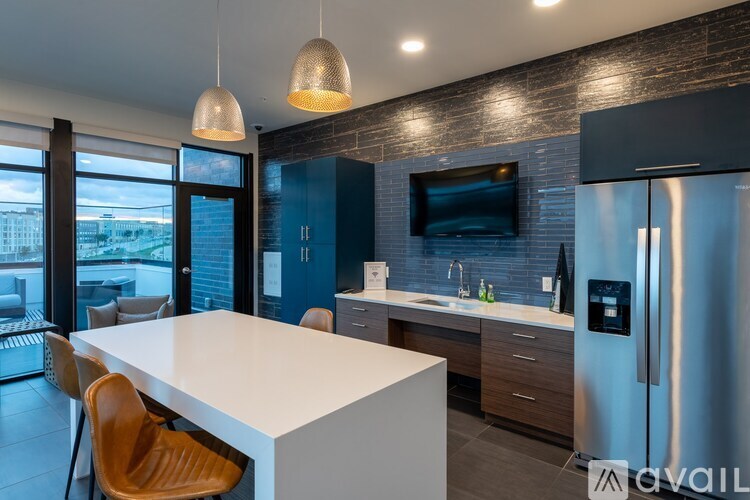 A modern kitchen with a white countertop and a large island.