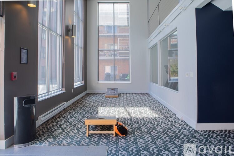 A room with a tiled floor and a bench.