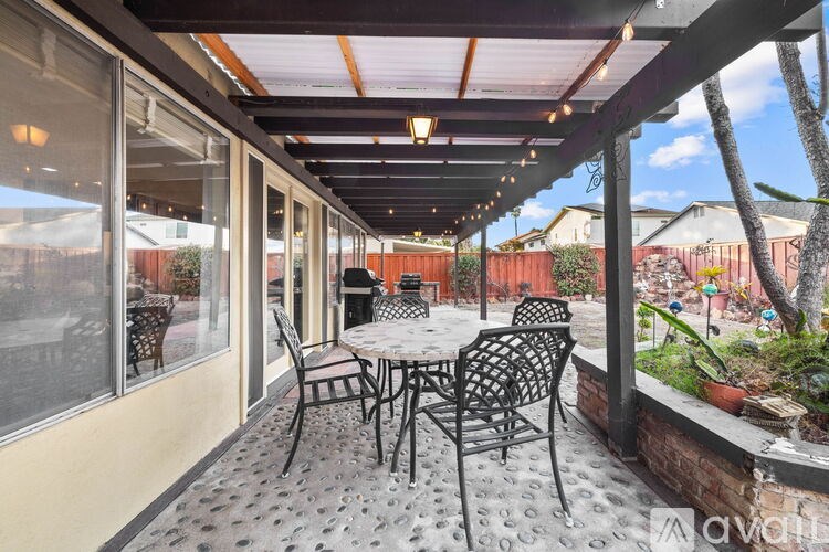 A patio with a table and chairs is shown.