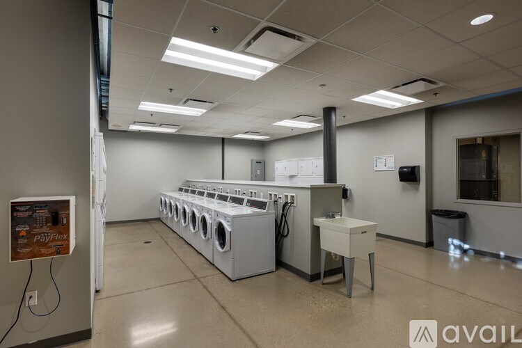 A room with a washing machine and a dryer.