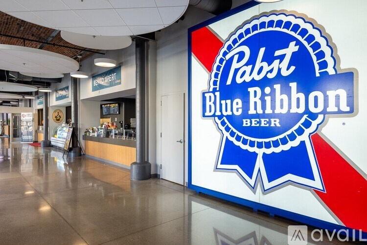 A Pabst Blue Ribbon beer sign is displayed in a store.