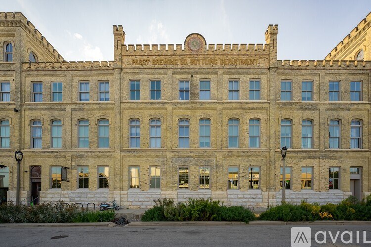 A large, old building with the words "Past, Present, and Future Department" written on the top.