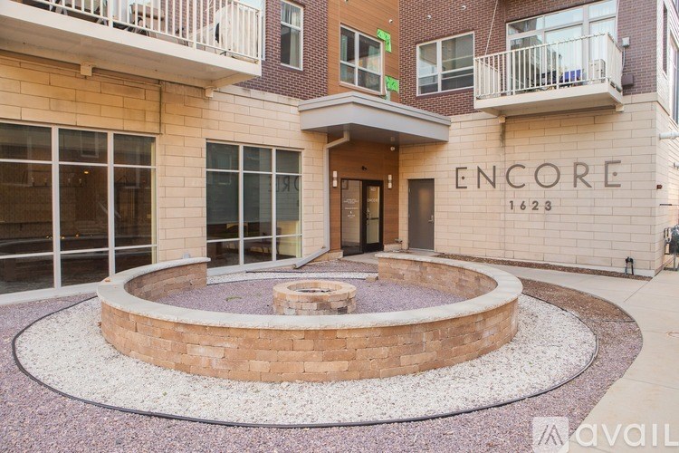 A building with the word "ENCORE" on it and the number "1623" below it.