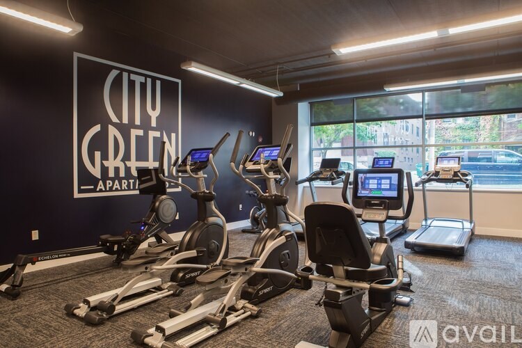 A gym with a sign that says City Green Apart.