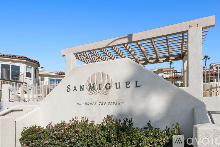 A large white sign with the name SAN MIGUEL on it.