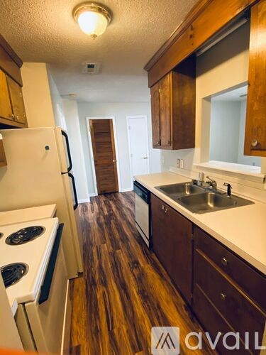 A bathroom with a toilet, sink, and bathtub.