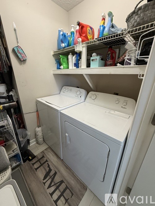 A yellow house with a white door and windows.