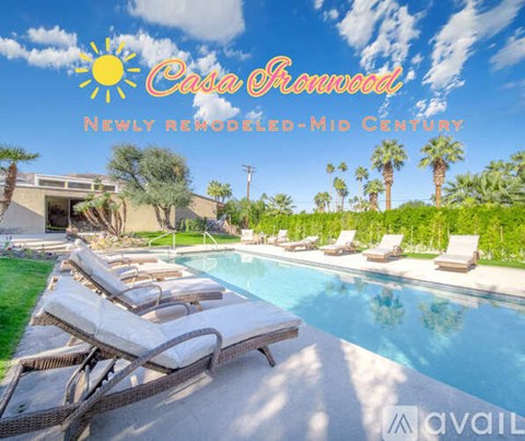 A newly remodeled mid-century house with a pool and lounge chairs.