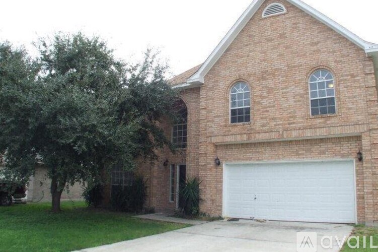 A brick house with a white garage door.