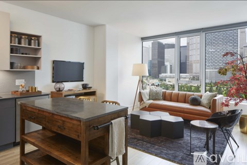 A modern living room with a wooden table and a couch.