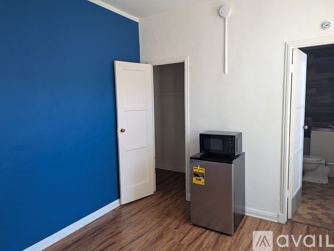 A white wall with a cable running across it.