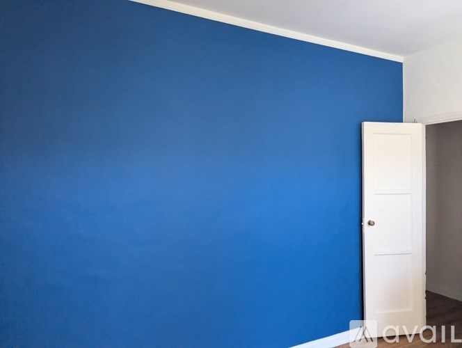 A white toilet in a small bathroom.
