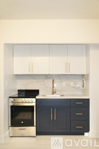 A kitchen with a stove and cabinets.