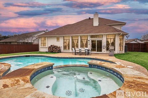 A house with a pool in the backyard.