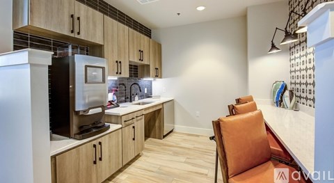 A kitchen with wooden cabinets and a refrigerator.
