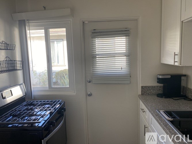 A room with a wooden floor and a wall.