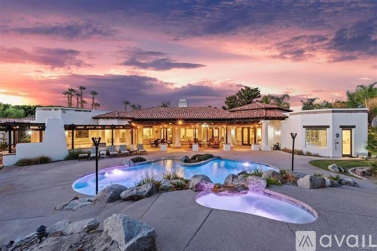 A modern house with a pool in the backyard.