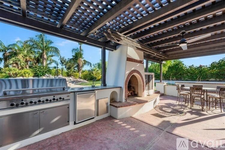 A patio with a grill and a built-in oven.