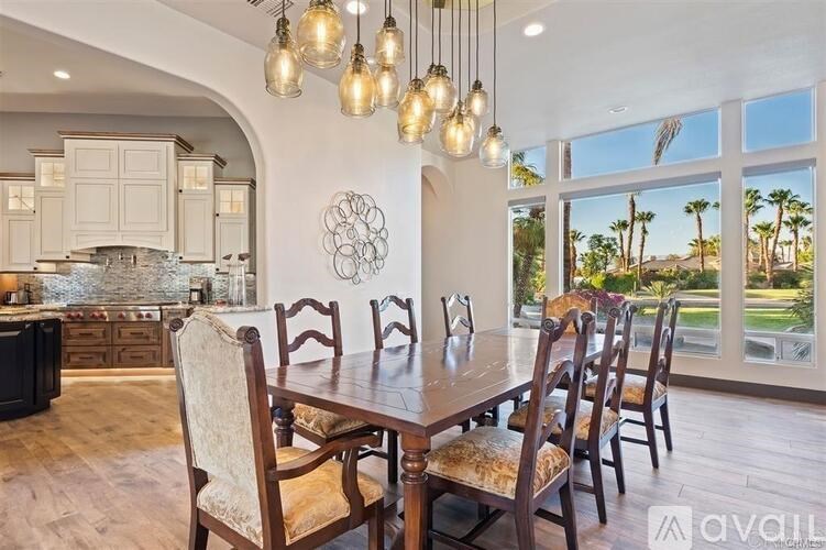A dining room with a table set for six.