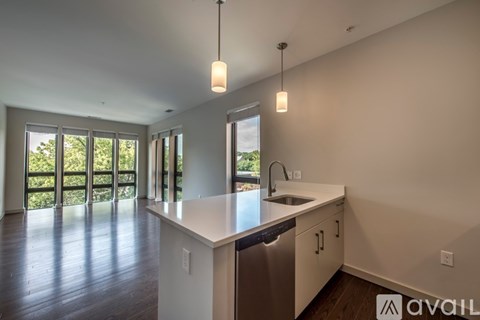 A kitchen with a sink and cabinets is available for rent.