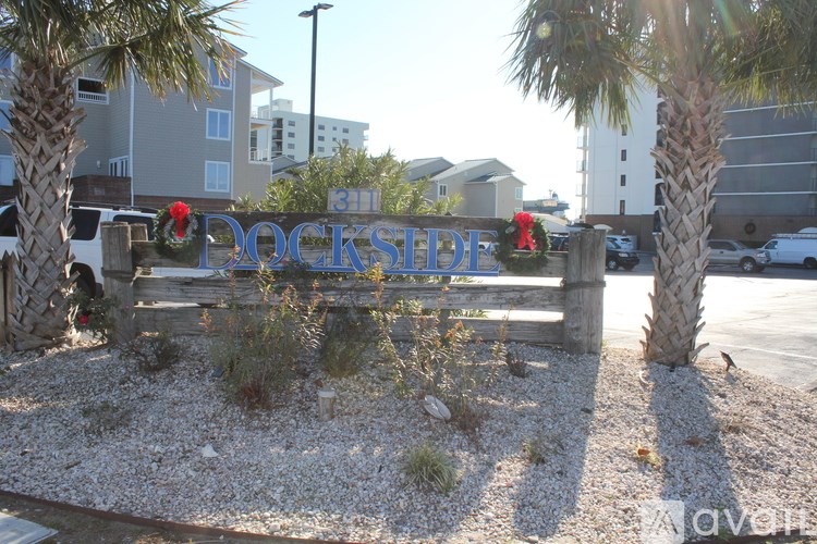 A sign that says Dockside is in front of a building.