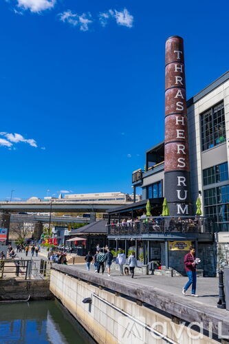 A tall red pillar with the word "THRASHERS" written on it in white letters.