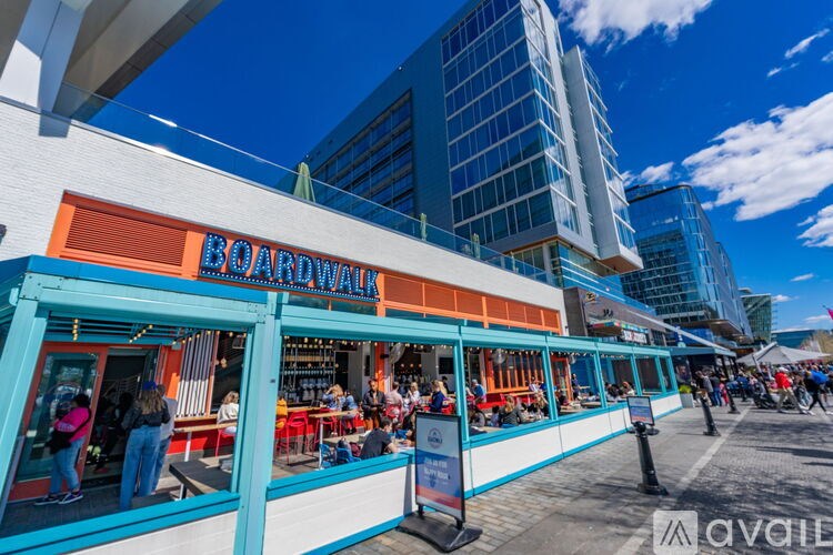 A boardwalk restaurant with people dining outside.