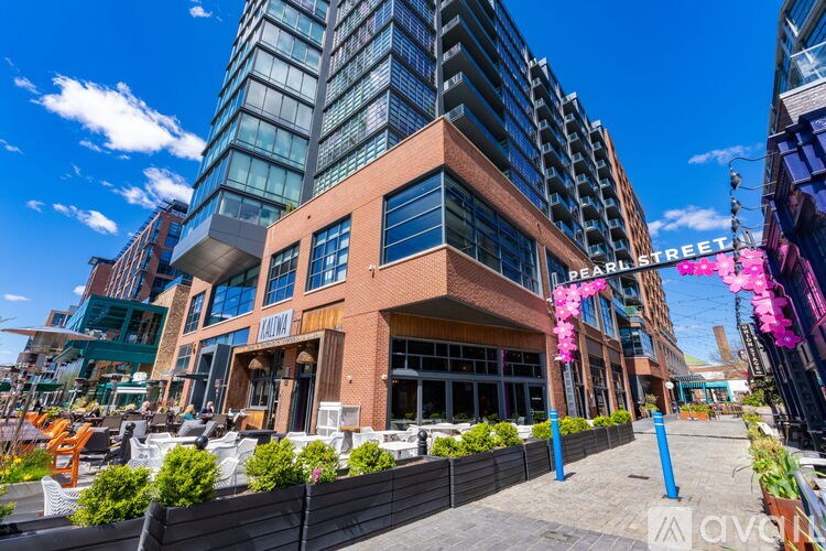 A modern building with a glass facade is located on Pearl Street.