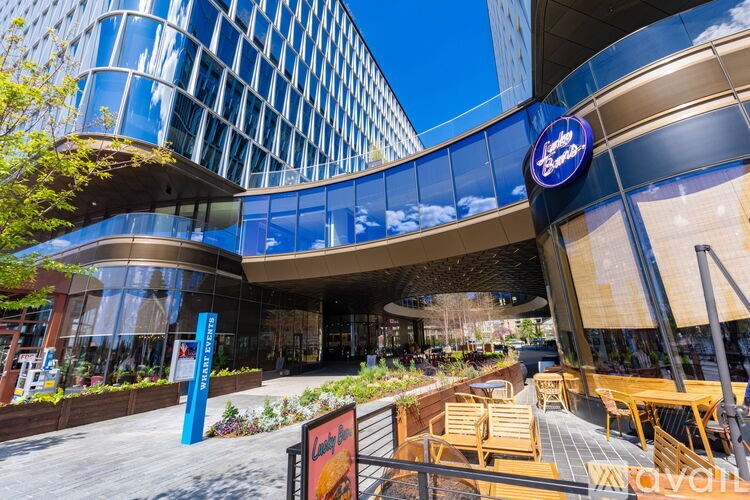 A modern building with a blue sign that says "The Blue".