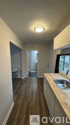 A kitchen with a sink and a window.
