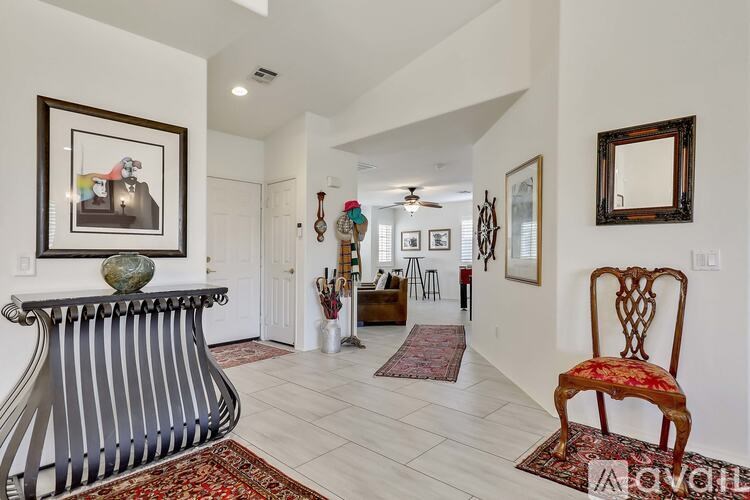 A living room with a chair and a bench.