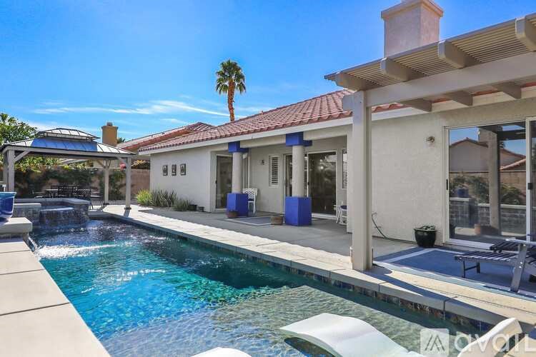 A house with a pool in the backyard.