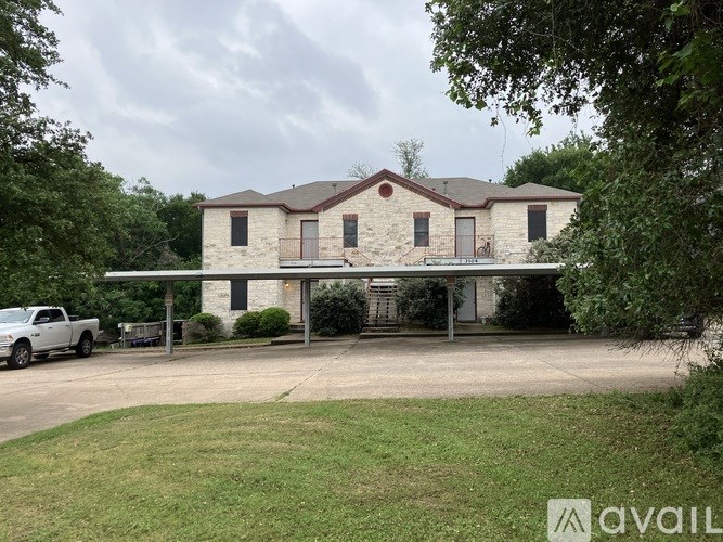 A house with a white truck parked in front.