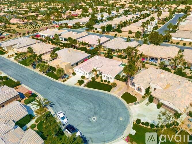 A residential area with houses and a swimming pool.