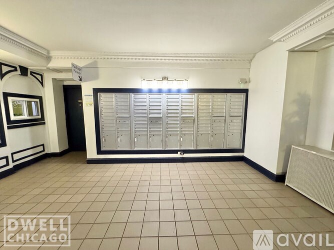 A room with a large closet and a tiled floor.