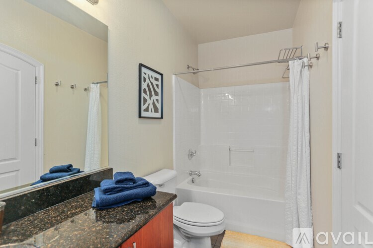 A bathroom with a toilet, sink, and shower.