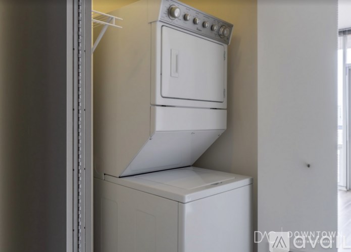 A white oven and dishwasher are installed in a kitchen.