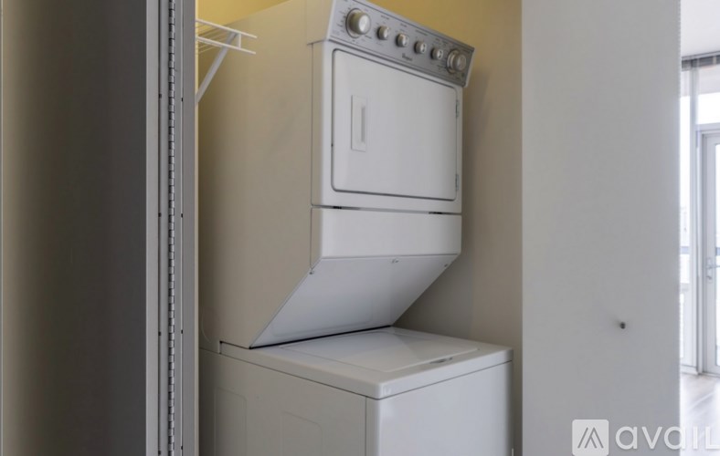 A white oven and dishwasher are installed in a kitchen.
