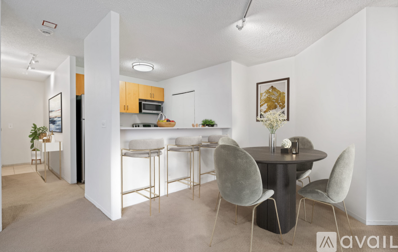 A modern kitchen with a dining table set up.