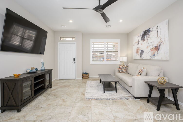 A spacious kitchen with a marble floor and a modern design.