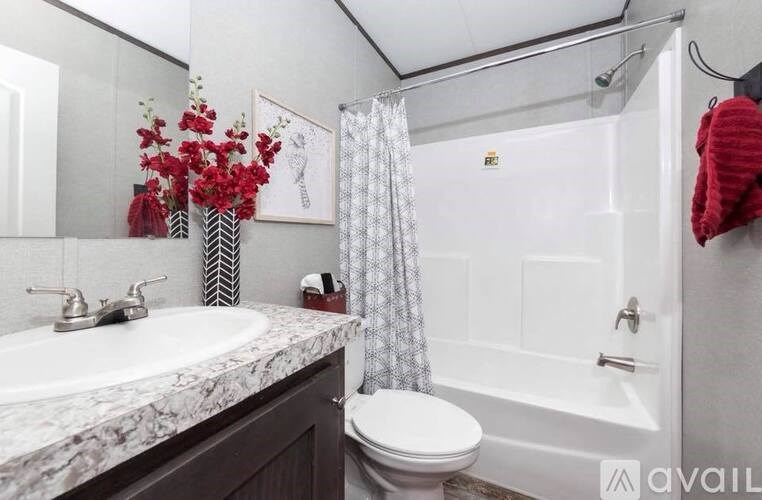A bathroom with a marble countertop and a white toilet.