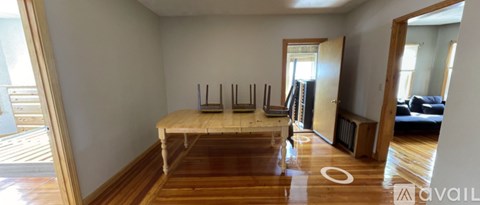 A room with a long table and chairs in the middle.