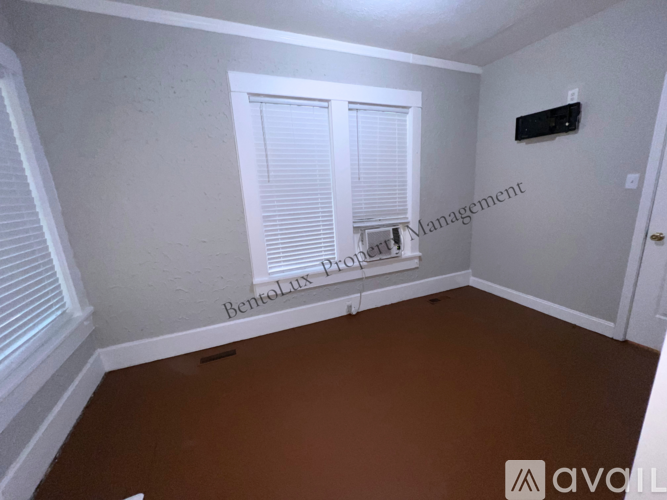 A white toilet and sink in a bathroom.