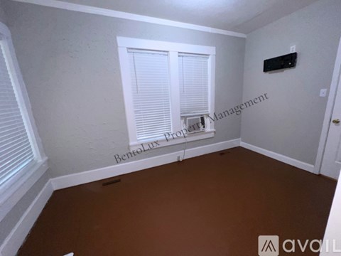 A white toilet and sink in a bathroom.