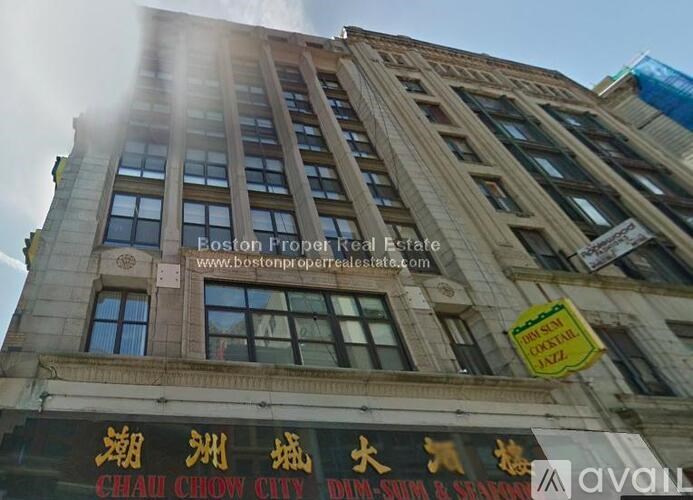A building with a sign that says "Boston Property Real Estate" on it.
