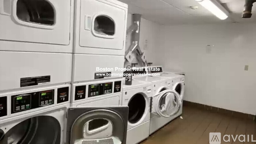 A row of washing machines in a laundromat.