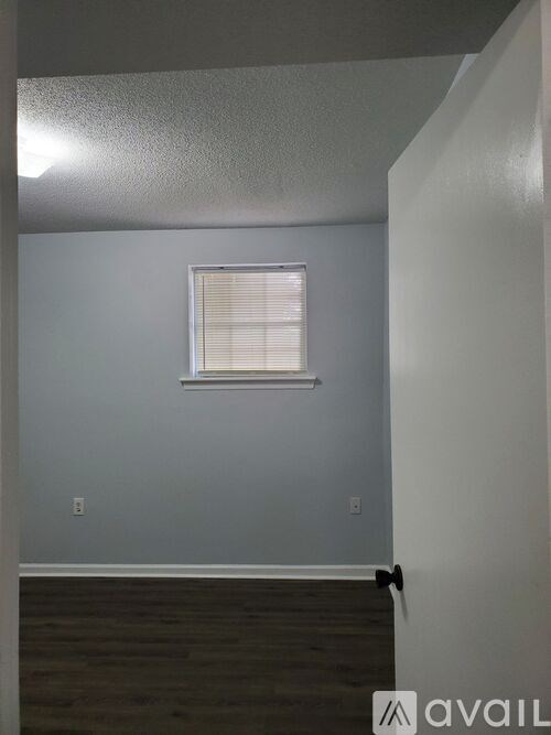 A room with a window and Avail logo.